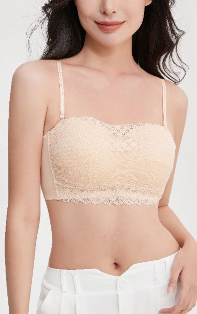 Woman wearing a beige Chic Allure Seamless Tube Top Wireless Bralette with detachable shoulder straps and elegant lace design, front view.