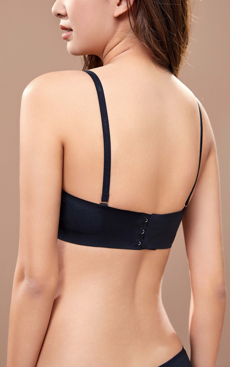 Back view of a black seamless wireless tube top bra with detachable straps, showcasing the elastic band.