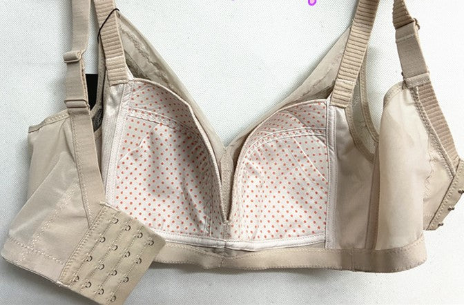Interior of Beige Bra with Hook Panel – The inside view of a beige bra, revealing the breathable mesh lining and hook extension for adjustable sizing.